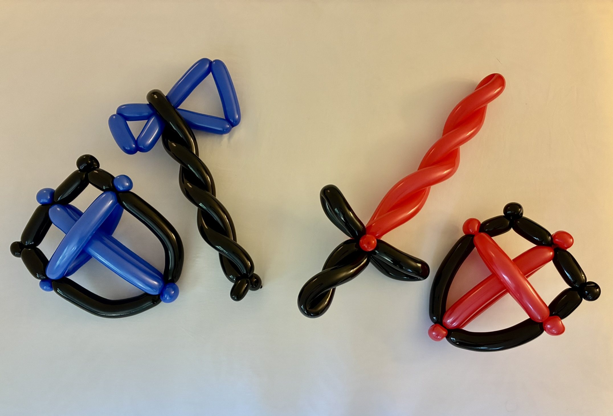 Blue, black, and red balloon sculptures